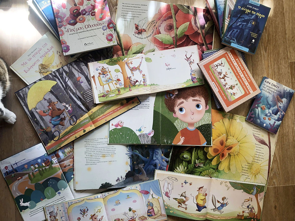 Photo of various children’s books illustrated by ANIMaD, showcasing colorful digital and watercolor illustrations.